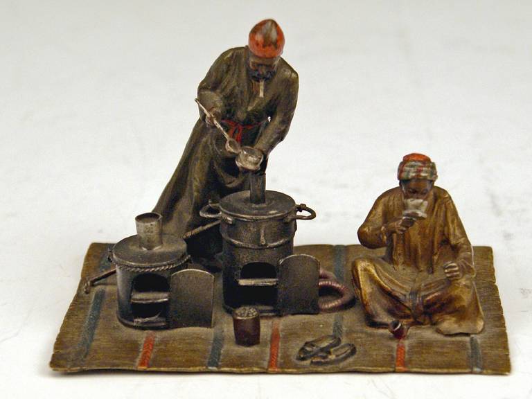 Gorgeous Vienna Bronze figurine made by famous manufactory Bergman(n)  circa 1900. 
One of the Arab Men is busy with preparation of tea: He stands in front of two ovens, pouring tea with a laddle into a cup  /  the second man sits cross-legged on
