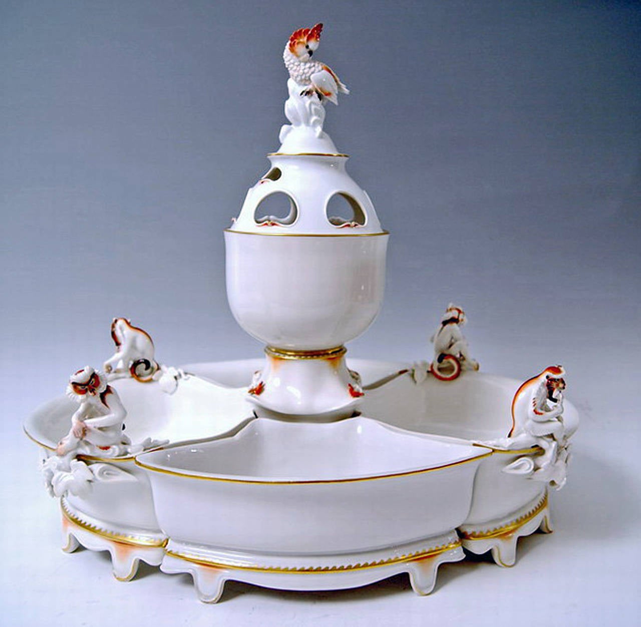 Meissen Art Deco Tall Centrepiece:
Large Bowl with Monkey and Cockatoo
created by  Max Esser  (1885 - 1945),   modelled  1922 

Hallmarked:
Meissen Crossed Sword Mark with Point above the Hilts  (PFEIFFER PERIOD, manufactured 1924 - 34)  / 