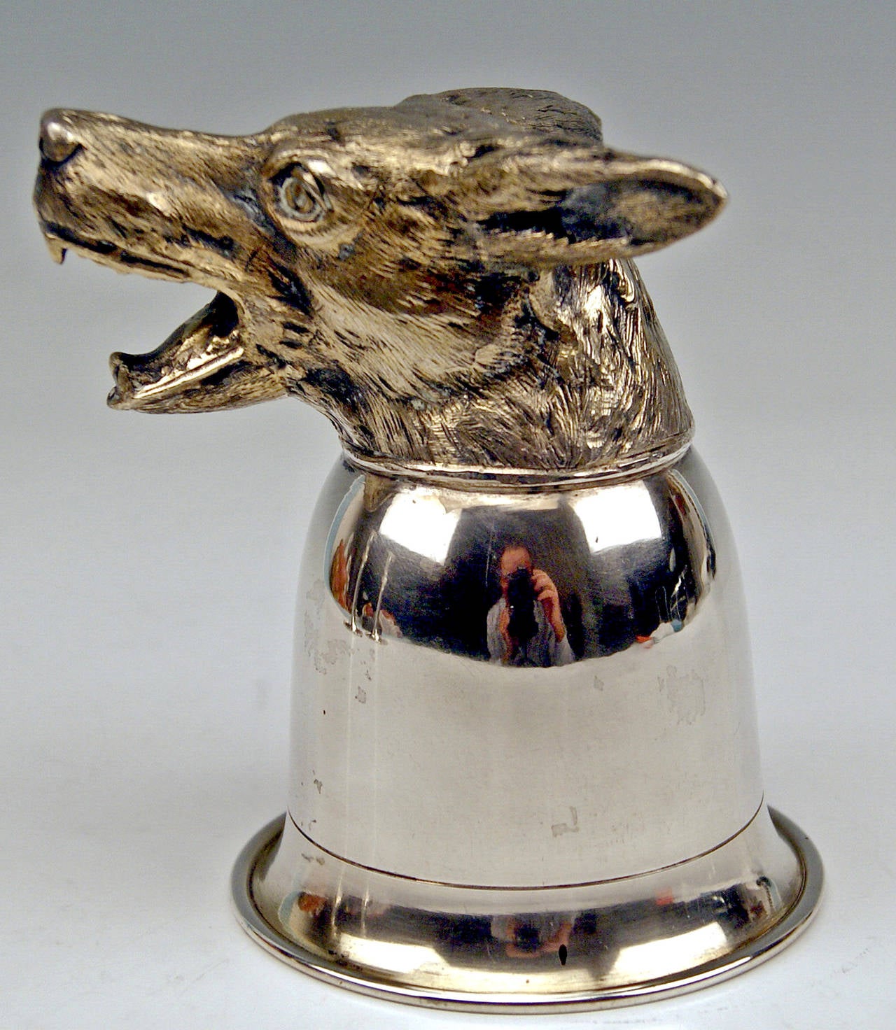 Silver Italian (Milan)  rare Beaker decorated with Head of a Snarling Wolf   (German: Sturzbecher) 
 made c. 1940-60    

Excellently made rarest beaker:  
The beaker has smooth surface, at bottom there is a sculptured head of snarling wolf