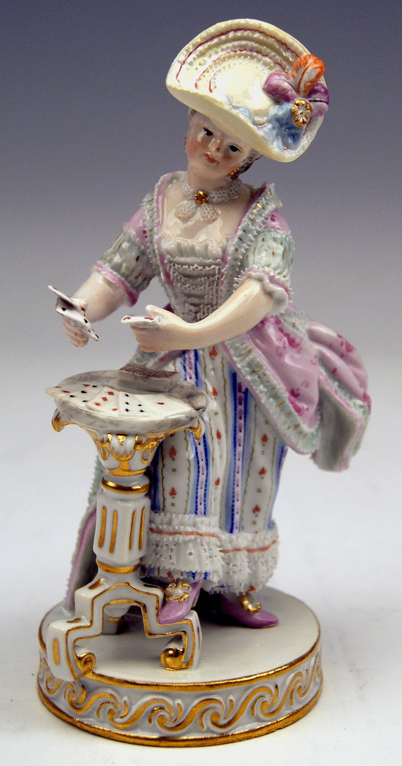 Meissen gorgeous as well as lovely figurine:  The Female Card Player.
DATING:            made circa  1870 - 80
MATERIAL:       white porcelain, glossy finish, finest painting 
TECHNIQUE:   handmade porcelain

DESIGNER:   
Michael Victor ACIER 