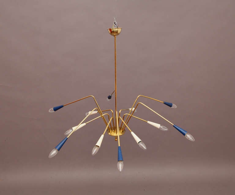 Sputnik hanging lamp, manufacturer Arredoluce, Monza 1950, Italy. 12 arms, brass, colored metal shades.

Height 43.3 in
Diameter 43.3