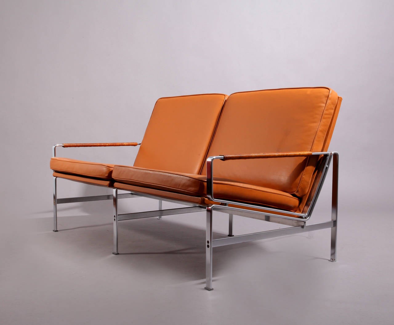 Two-seat sofa FK 6720 by Fabricius & Kastholm, 1967.
Made by Kill International, Germany.
Brown natural leather, chromed steel.
Measures: Wide 57
