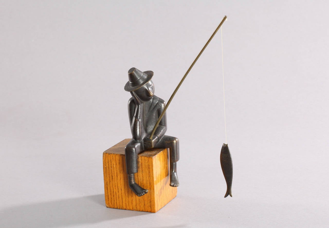 Brass sculpture,
Sitting fisher man,
Werkstaette Hagenauer,
Marks on the wooden base WHW, made in Austria.
Vienna, 1950.
Wood/brass.
