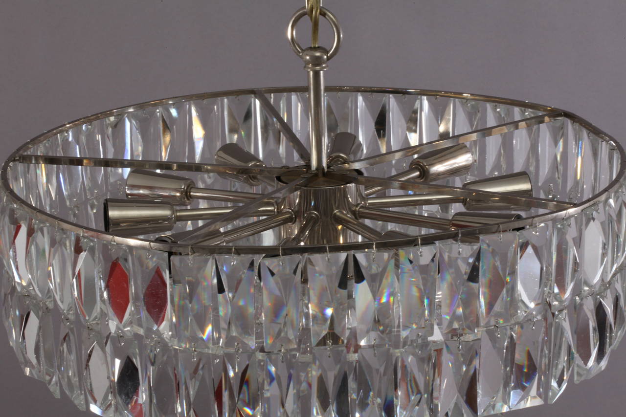 Very beautiful and high quality chandelier by Bakalowits & Sohne from the 1960s. It is made of hand-cut crystals, large rhomb shaped crystals and a nickel-plated (chrome) frame. Ten-light sockets.
Measures: Height 50 inch (The height can be ordered