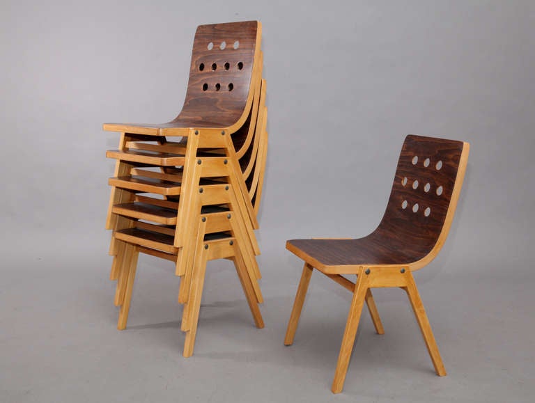 6 Austrian stacking chairs in beechwood and bent plywood designed by Roland Rainer, manufactured by E. & A. Pollack, c. 1956.

The chairs were designed for Vienna City Hall and were used for concerts and entertainment.