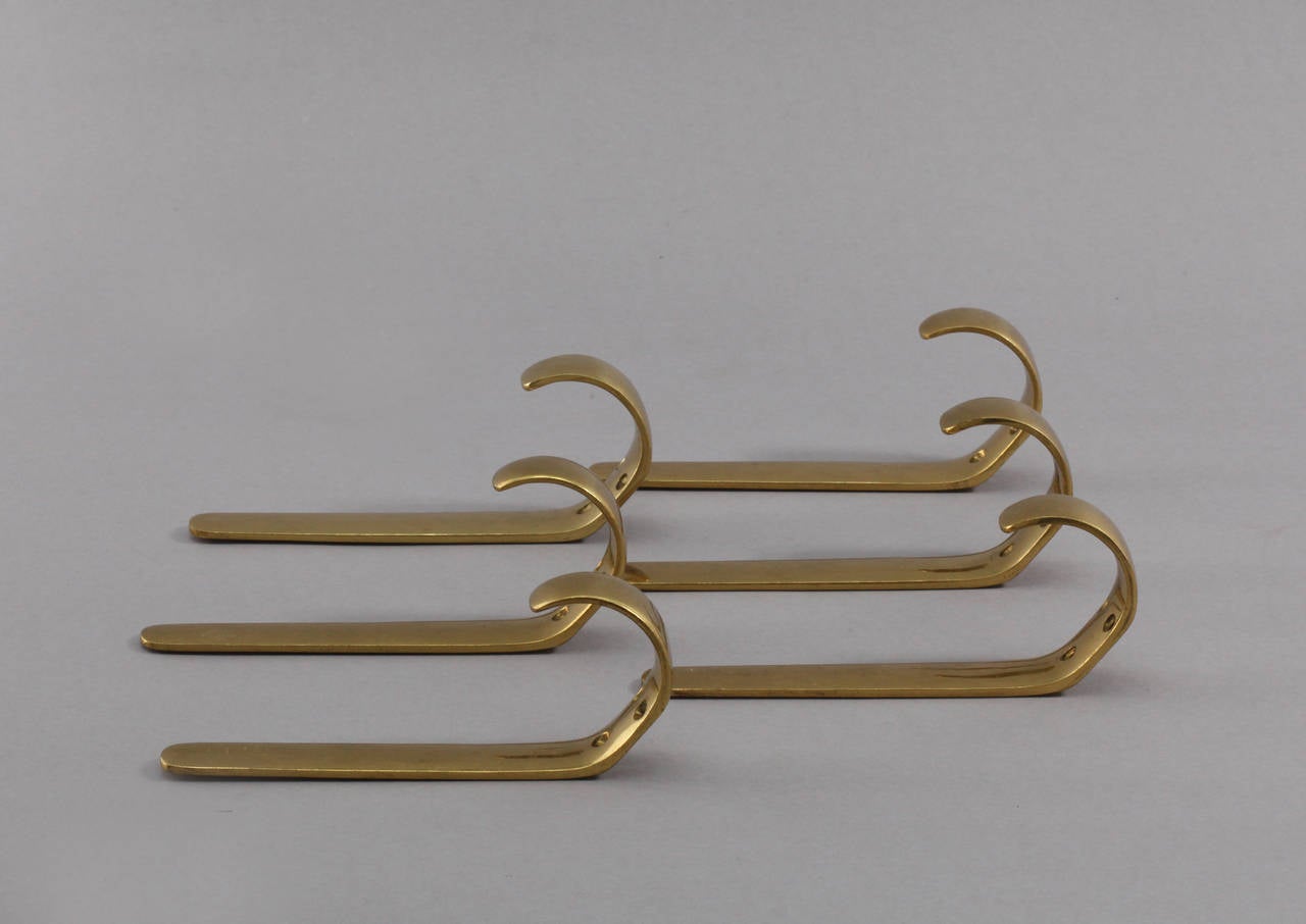 A set of six beautiful Austrian brass hooks, made brass, polished, executed in the 1950s by Baller Austria. In the style of Carl Auböck. 
In very good condition, with marginal patina.