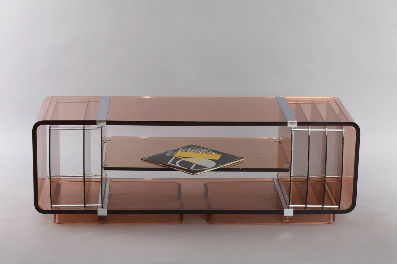 Vinyl records stand,
smoked Lucite,
Space Age,
1970.
Measures: Height 17 inch, depth 17 inch, width 51 inch.
