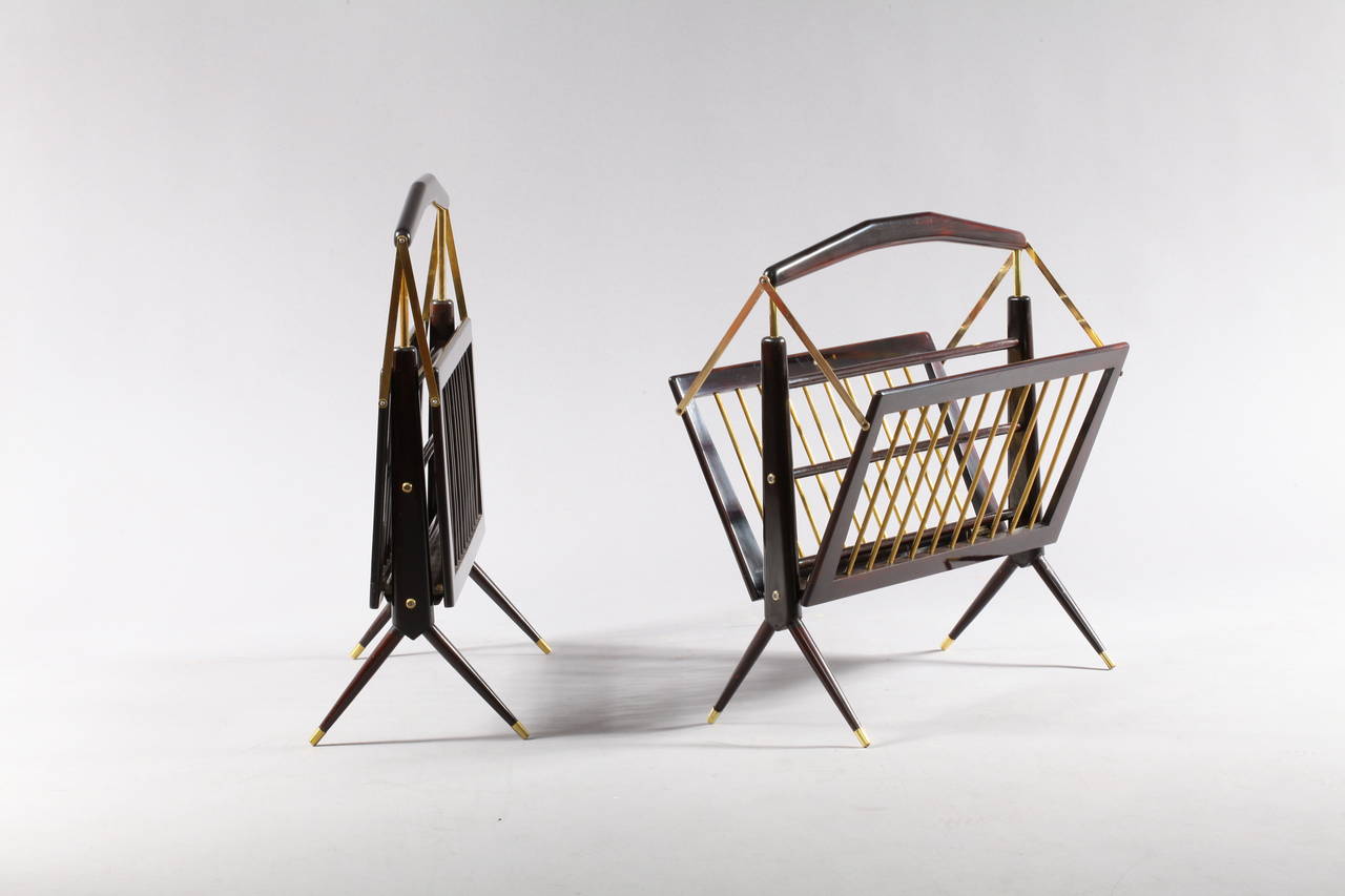 A pair foldable newspaper rack,
designed by Cesare Lacca,
Italy, 1950.
darkbrown mahogany, brass.
Measures: Length 20inch (50cm, depth 12(30cm), height 23(57cm).