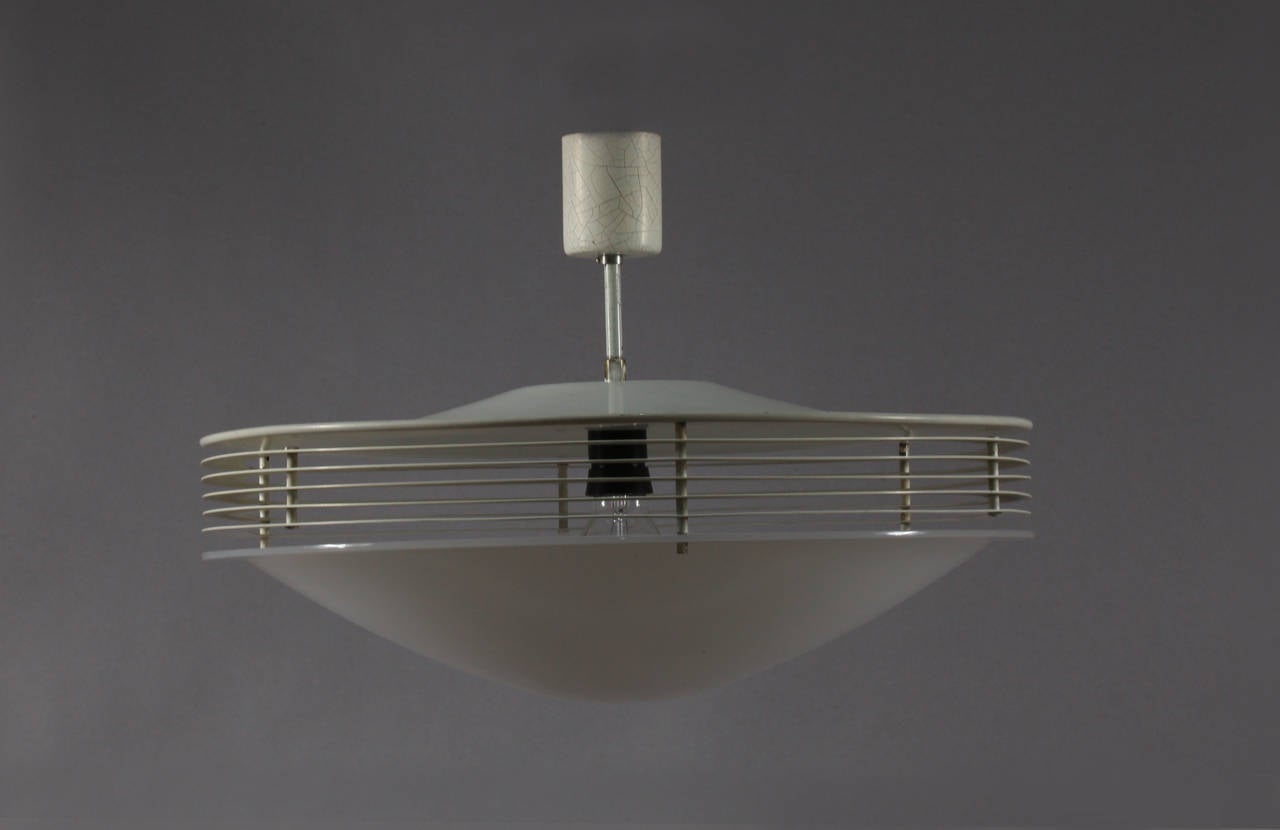 Diffusion ceiling lamp
designed by Stilnovo
Italy, 1960.
Dimensions: Diameter 20 inch (50cm),
height 12 inch (30cm).