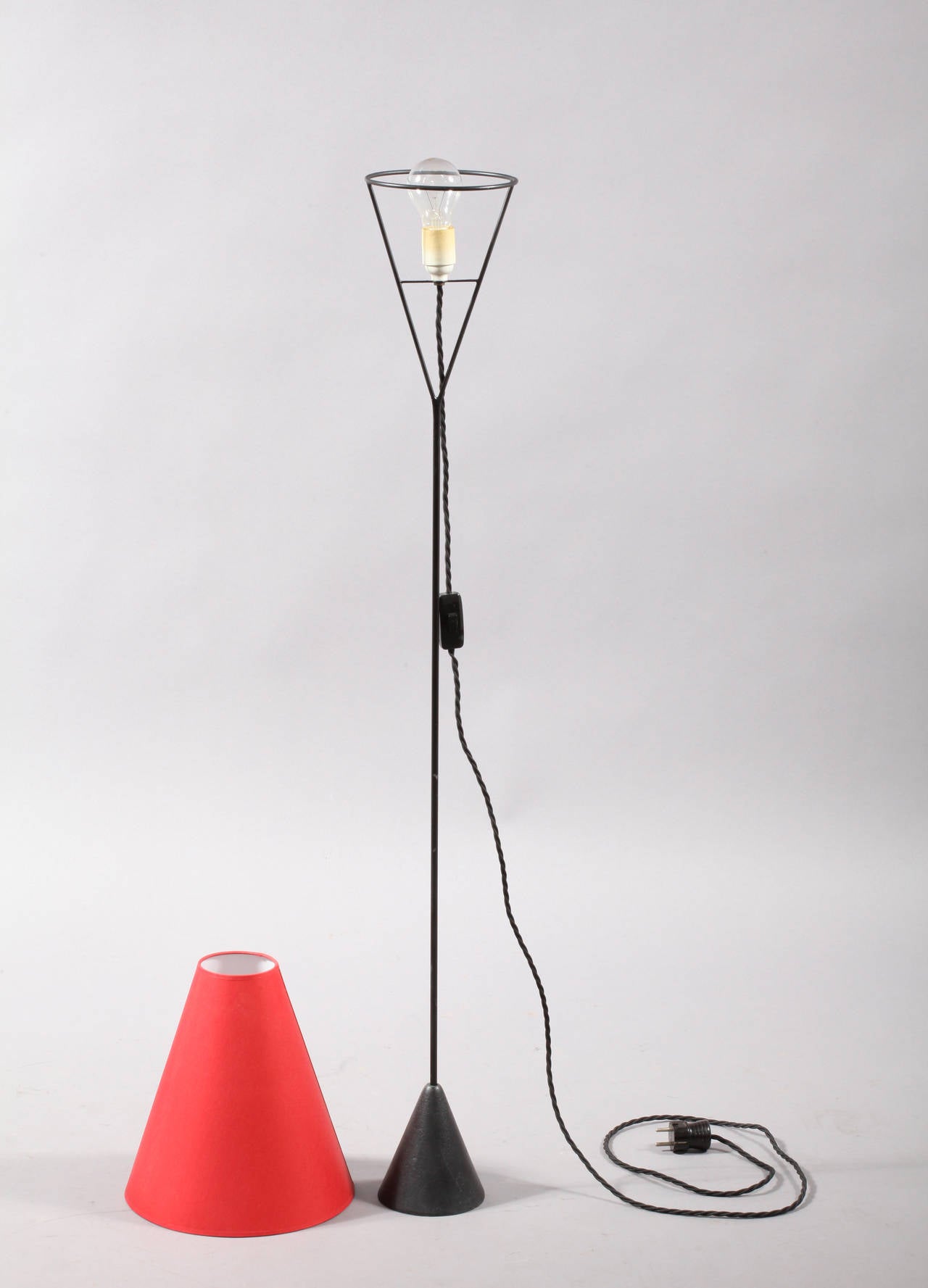 Vice versa floor lamp.
Designed and produced by Carl Auböck, Vienna, 1950.
An icon of modernist lighting designed by Carl Auböck in 1954, this lamp can be used as either a torchere or as a floor lamp depending on how the shade is placed on the