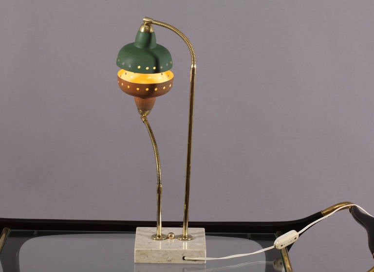Table lamp,
Attributed Arredoluce,
Italy, 1950. Marble base,
Two adjustable metal shades.
Measures: Height 20