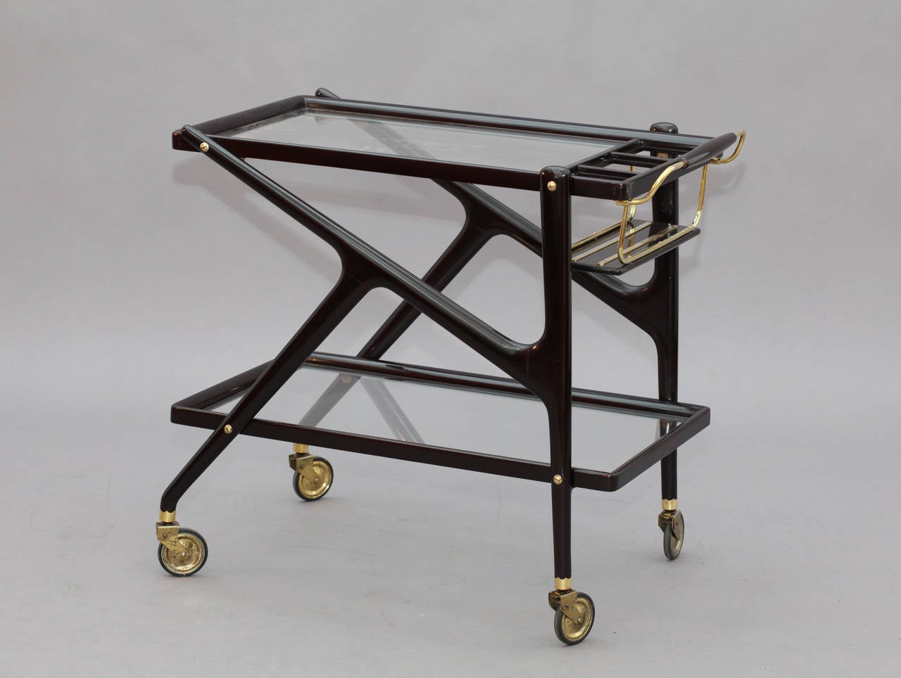 Bar trolley,
Designed Cesare Lacca,
Italy, 1950.
Solid walnut dark brown,
Brass handles,
Length 31