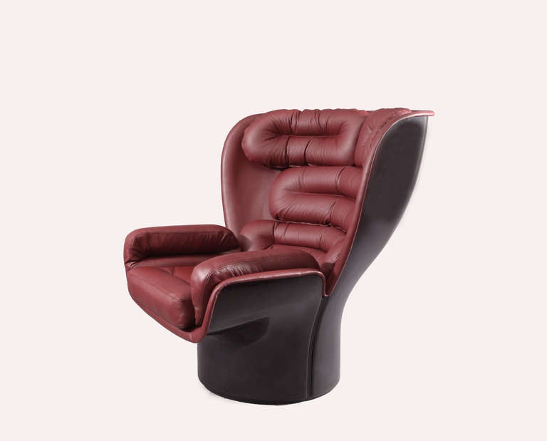 Elda Chair.  Designer Joe Colombo.  Manufacturer Comfort.
Red/brown leather, black fiberglass.  Italy 1960.