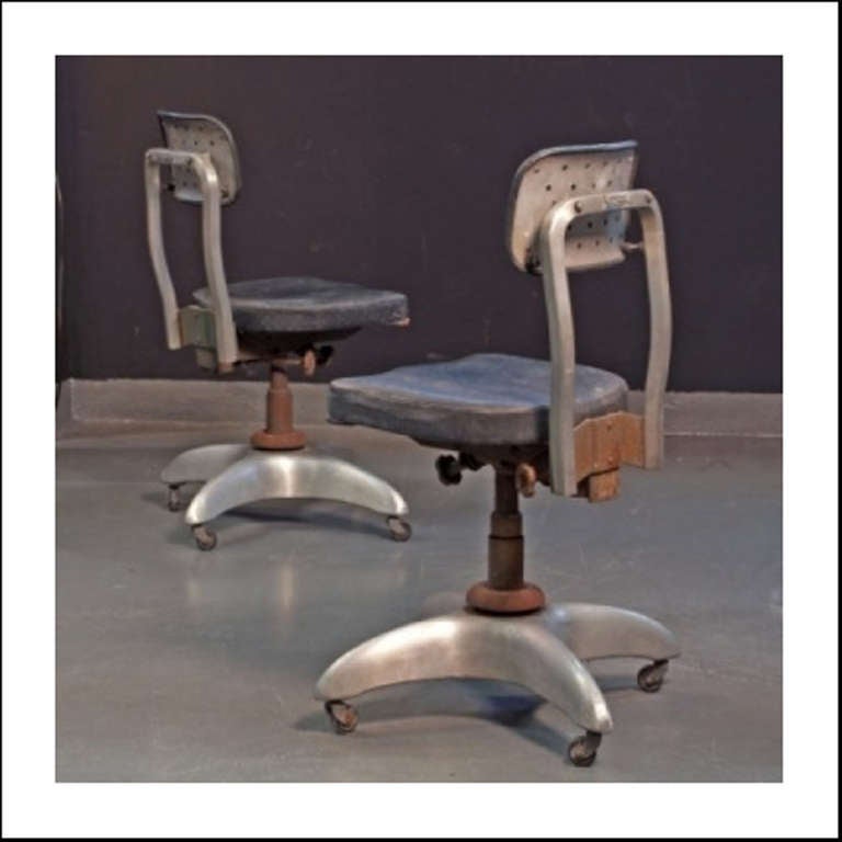 From the Vembi-Burroughs Offices, Genova.  Aluminum adjustable secretary's chair with a square leatherette seat and back rest mounted on single central leg supported by a four-arm aluminum base with four casters.

Accompanied by Certificate of