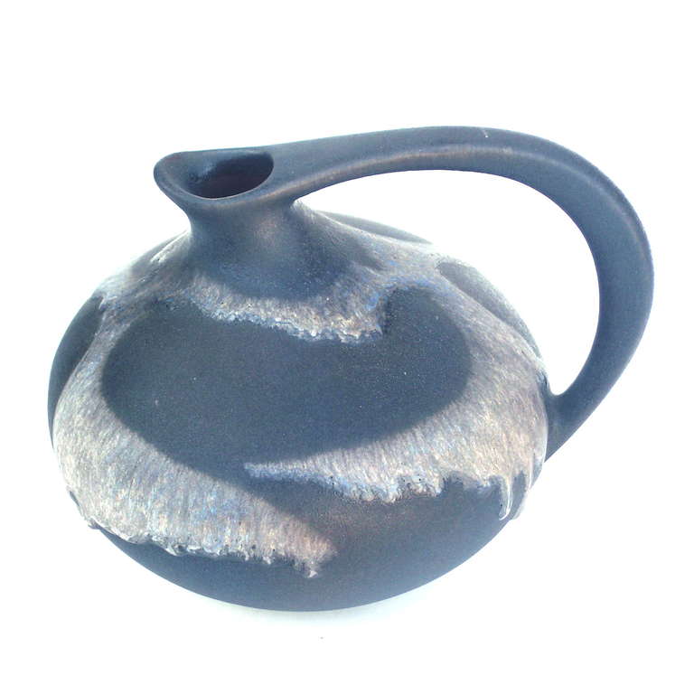 A stunning piece of art, is what this Ruscha 313 decor vase is all about. 

This vase is a true collectors item.

Design by Kurt Tschörner (Germany) 1954.

Decor No.: 313.

Manufacturer: Ruscha, Germany.

Shipping is not included in