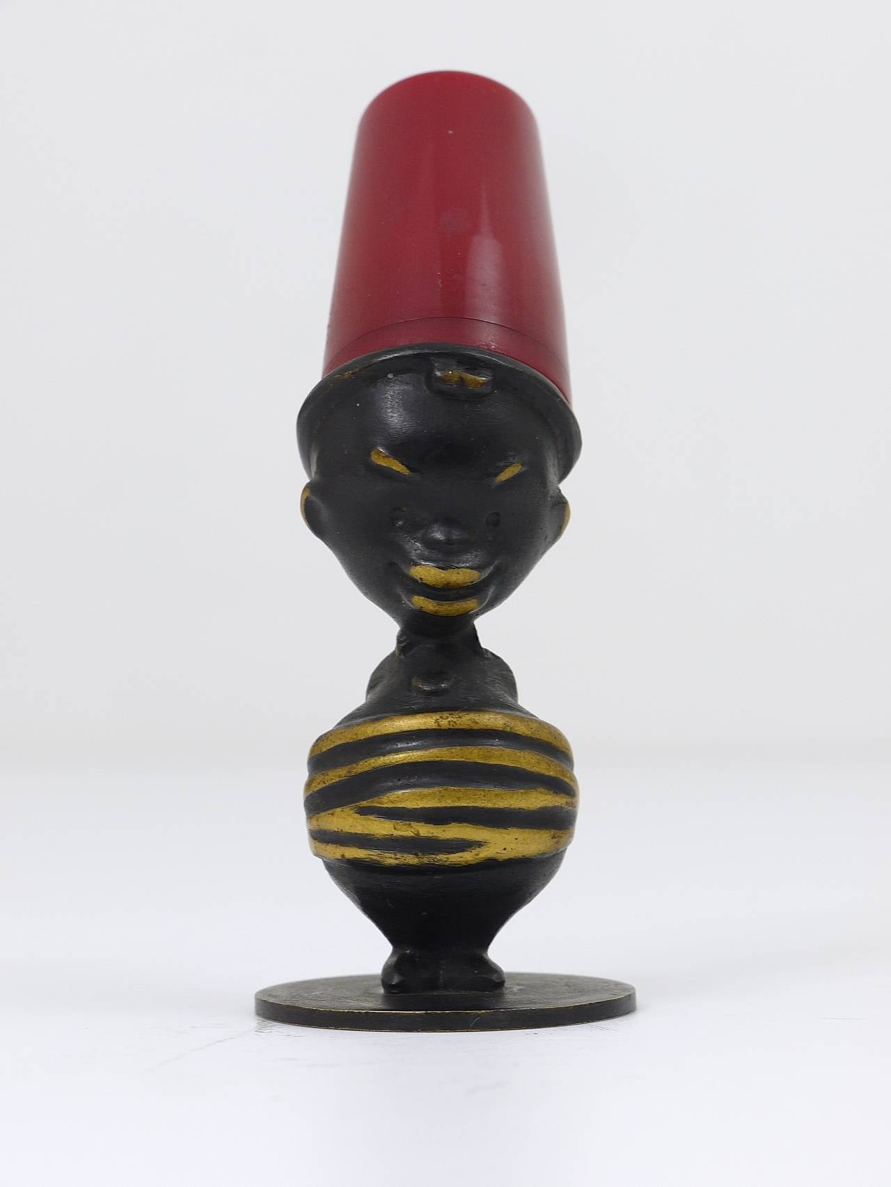 A unusual Viennese modernist salt shaker, designed and executed in the 1950s by Richard Rohac, who worked also for WHW Hagenauer Vienna. Made of black-finished brass and red bakelite. In very good condition.