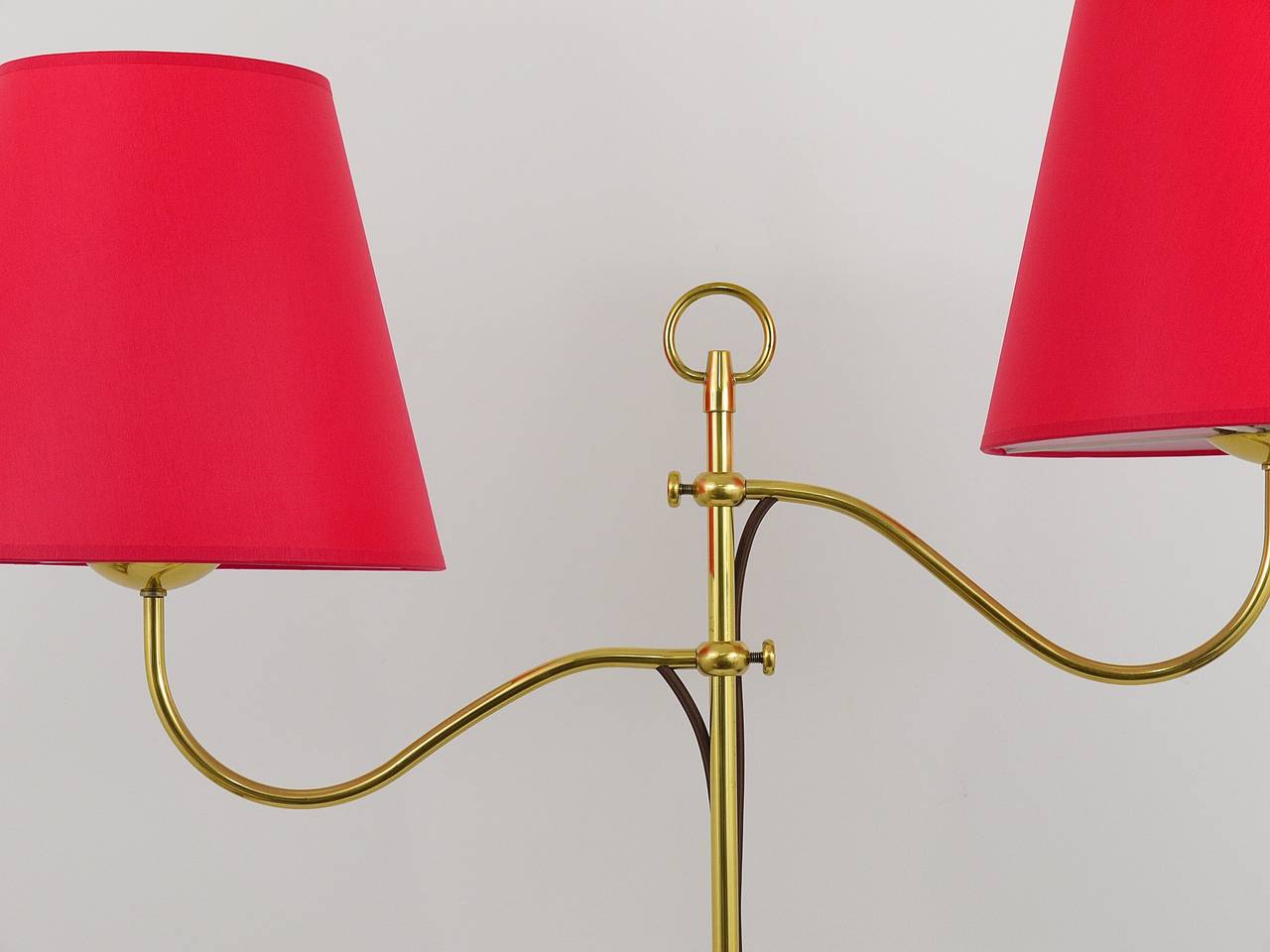 A very beautiful and unusual Viennese brass floor lamp, designed by Josef Frank in the early 1950s. A charming lamp with two rotatable and height-adjustable arms and lovely details. In excellent condition. Has been carefully restored and rewired and