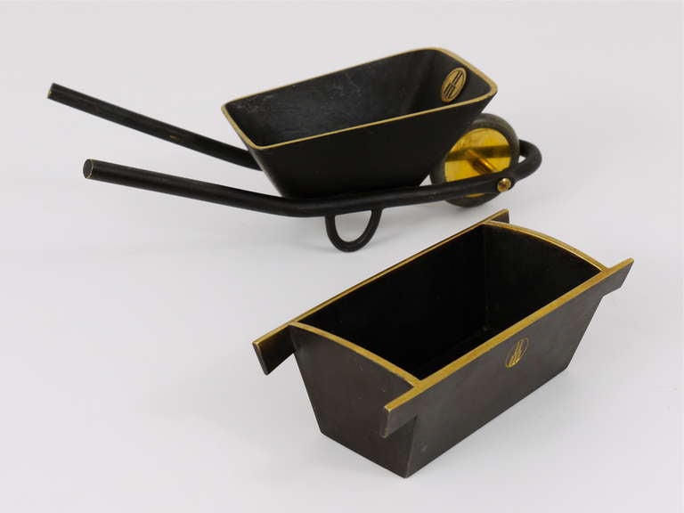 A very unusual office desk set, designed and executed by Carl Aubock in the 1950s, made as merchandising items for a Viennese building company. To use for business cards or paper clips. Handmade of black-finished, partly polished brass. Very