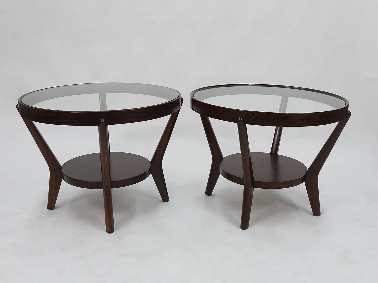 Two very beautiful and elegant round table with glass top, designed in the 1930s by Jindrich Halabala, who worked for Gropius at the Bauhaus. To use as a coffee or side table. In excellent condition. Two matching tables available, price per piece.