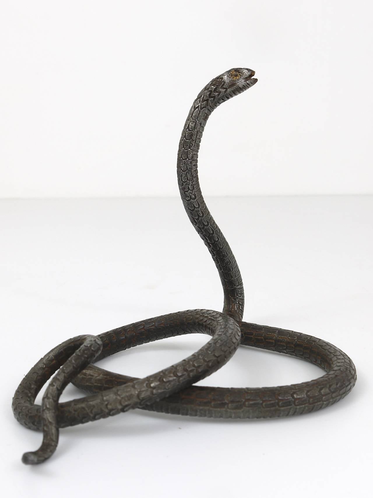 A handmade sculpture of of a snake, handmade of forged iron by a Viennese metalworker in the 1920s. Height: 5