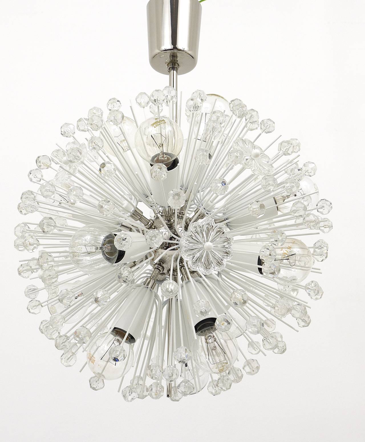 A beautiful  Mid-Century snowflake blowball sputnik chandelier from the 1950s. Designed by Emil Stejnar, manufactured by Rupert Nikoll Vienna / Austria. Made of nickel-plated brass, fully covered with faceted crystal balls and glass flowers.  It
