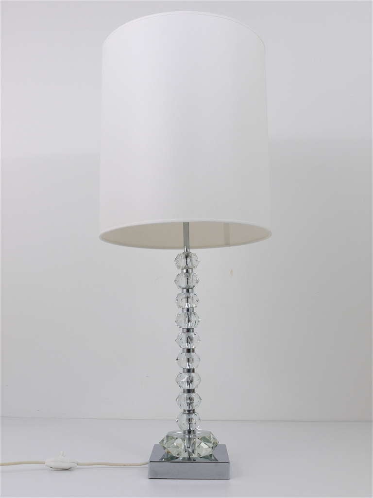 A very beautiful table lamp, executed in the 1970s by Bakalowits & Sohne Vienna. Very outstanding, nickel-plated metal base with huge faceted crystals and a white cylindric lampshade (professionally refurbished). The smaller diamonds have a diameter