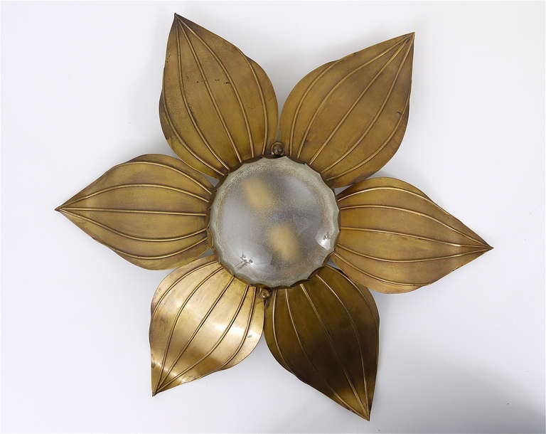 A pair of exceptional French modernist flower sconces from the 1950s. Made of brass with a satined round center glass.  Very simple but beautiful. Each sconce has two sockets. Rewired. In good condition with nice patina on the brass. Making a