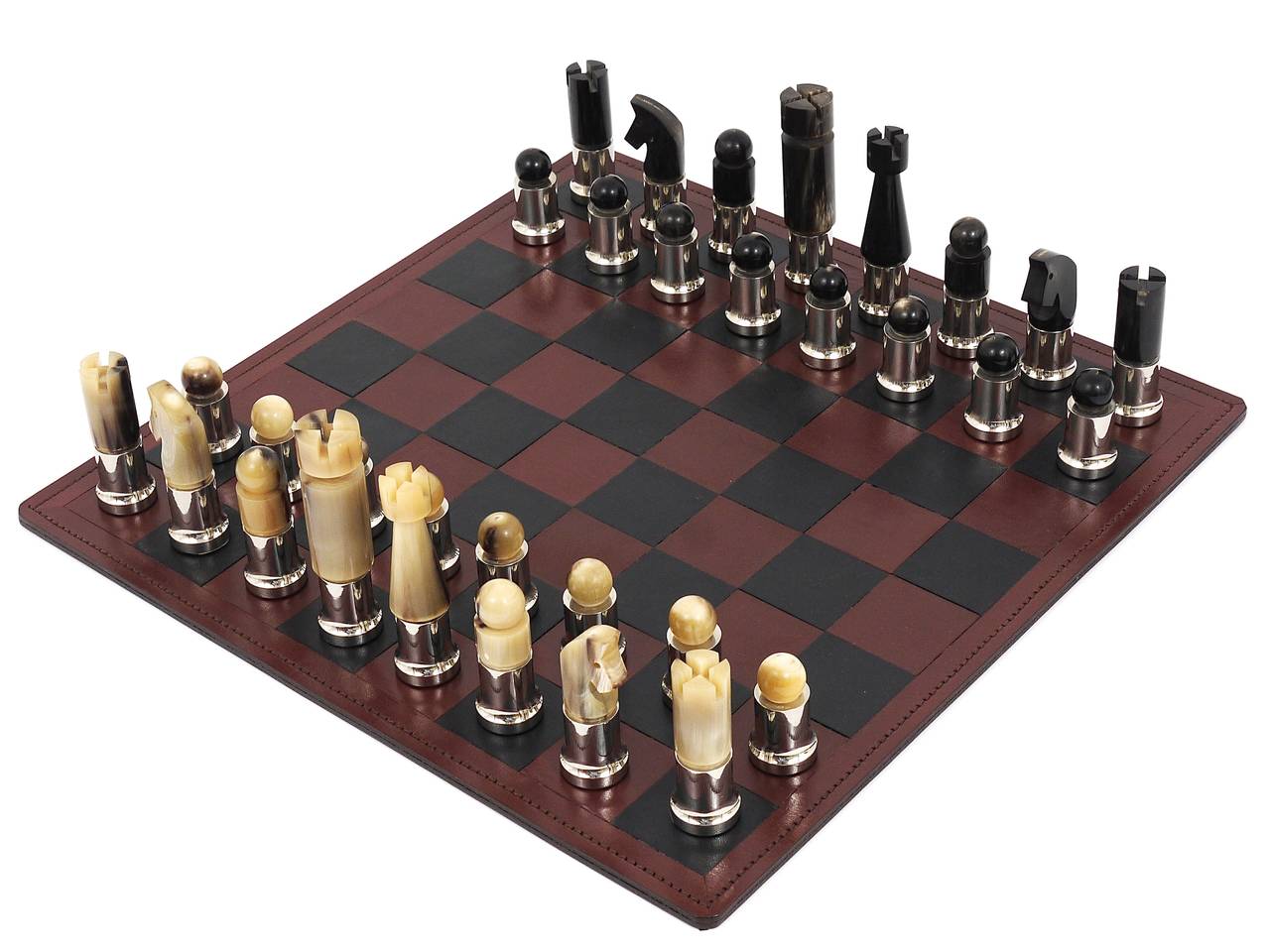 Very exceptional and beautiful Austrian chess game/chess men, designed and executed in the early 1970s by Austrian Modernist Carl Auböck. Discontinued vintage chess game, made of light and dark cow Horn and nickel-plated metal. Comes with