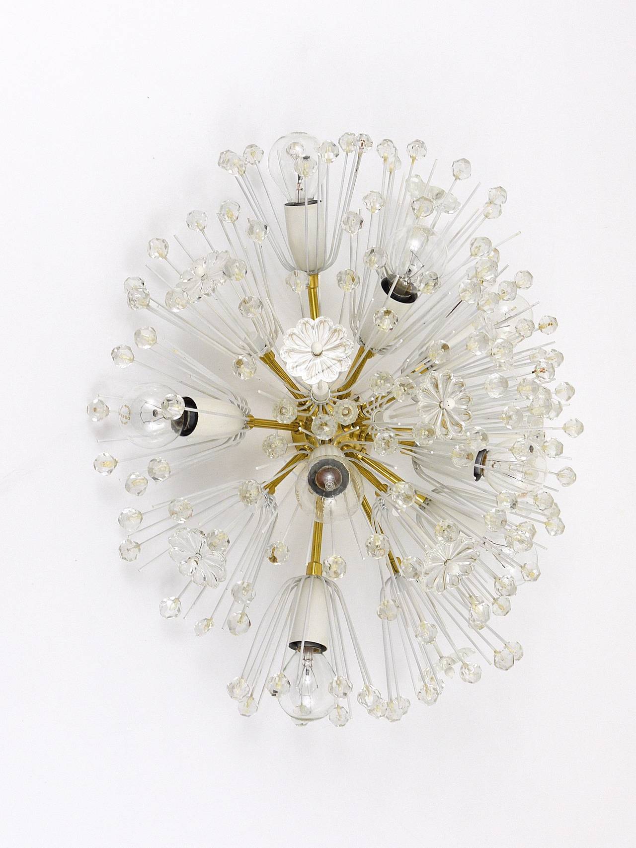 A beautiful oval Austrian blowball light, to use as a flush-mount or wall light / sconce. Designed by Emil Stejnar, executed by Rupert Nikoll, Vienna. Made of brass, fully covered with flowers and crystals. Very good condition, marginal patina. 8
