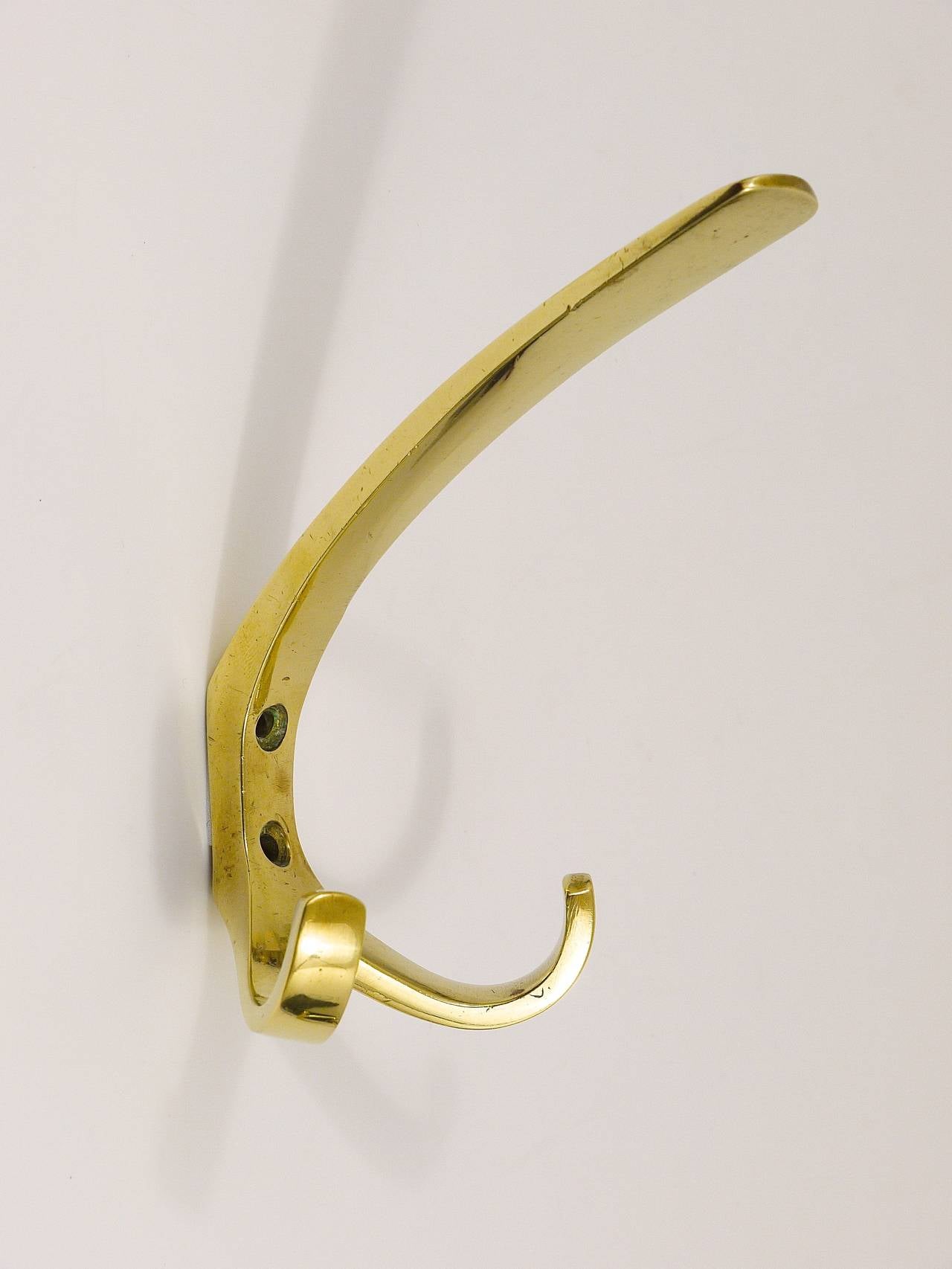 One (1) Austrian brass wall hook, executed in the 1950s by Baller, Austria. In good condition with nice patina. 