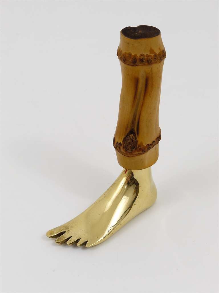 A very beautiful cork screw in the shape of a foot, made of brass and bamboo, designed and executed by Carl Aubock/Vienna in the 1950s. In very good condition, with nice patina. Marked on its underneath, 5 1/2