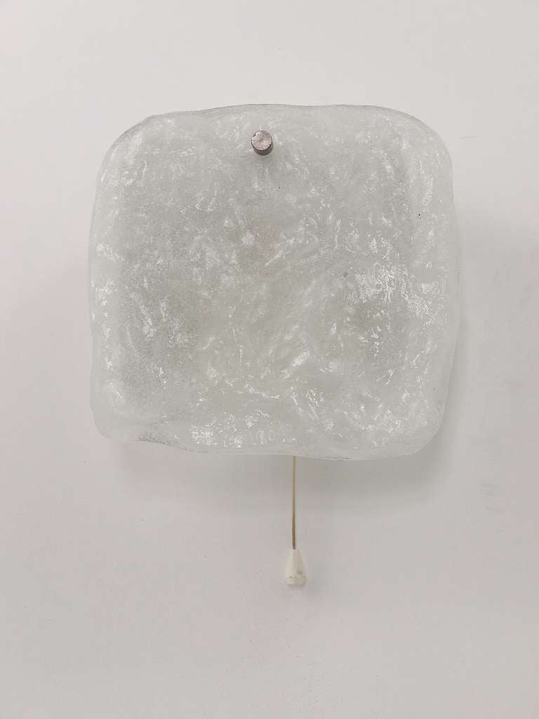 A beautiful wall lamp, manufactured by J.T. Kalmar Austria in the 1960s. Stunning design, it has a square frosted ice glass panel (7x7 inch) dangling on it. In good condition with nice patina on the metal base and a chrome backplate. Width: 7