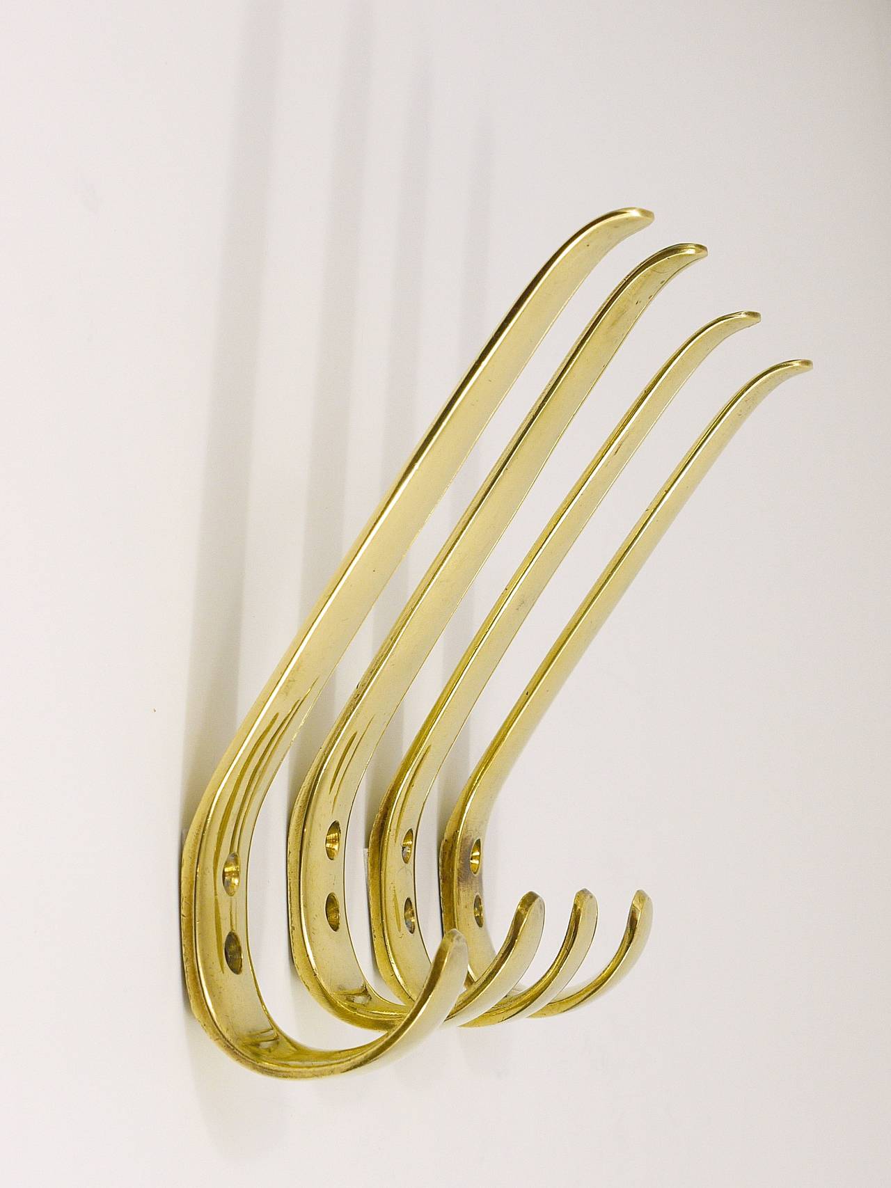 Up to 9 beautiful Austrian brass wall hooks, executed in the 1950s by Baller Austria. Gently polished by hand, in excellent condition with nice patina. 9 hooks available, sold separately, the price is per piece.