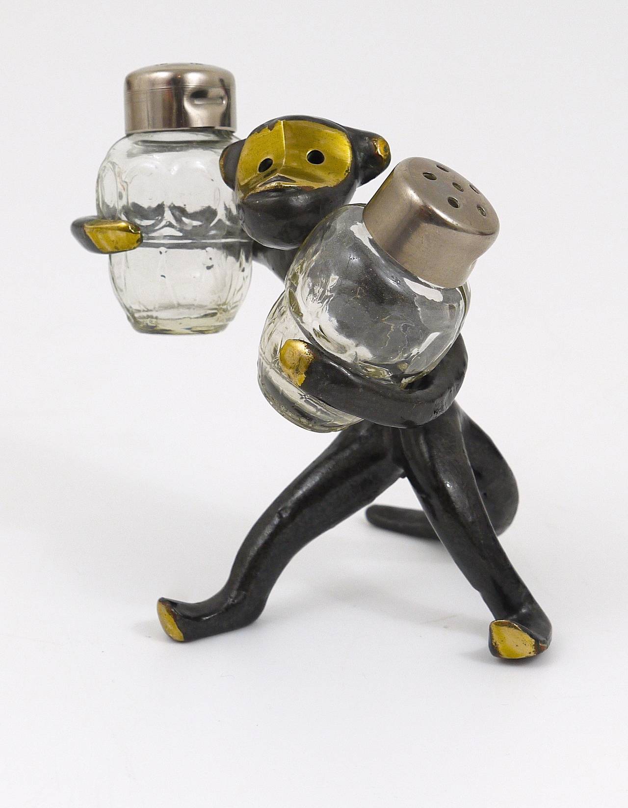 A very charming Austrian shaker set, displaying a monkey. A very humorous design by Walter Bosse, executed by Baller Austria in the 1950s. Made of brass, in excellent condition.