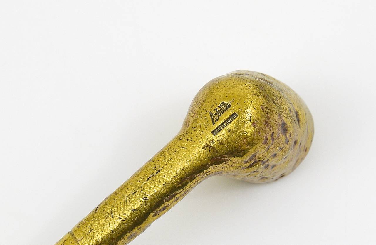 An Austrian brass paperweight, displaying a pipe, designed an executed in the 1950s by Carl Aubock, Vienna. Model #5188. A very decorative item, in very good condition. Marked.
