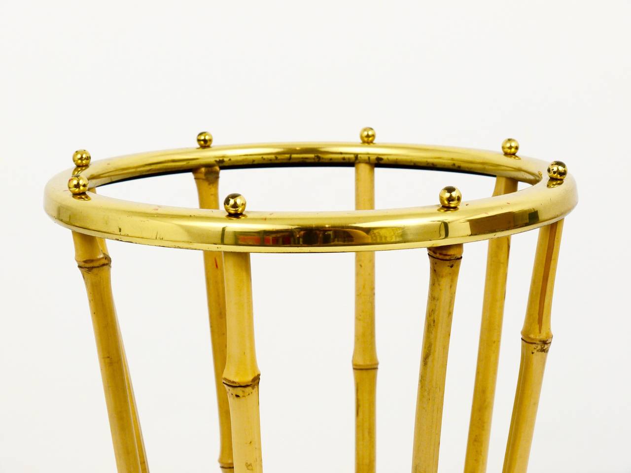 A beautiful Mid-Century bamboo and brass umbrella stand. Made in Austria in the 1950s. In good condition with nice patina on the brass. In the style of Carl Auböck.