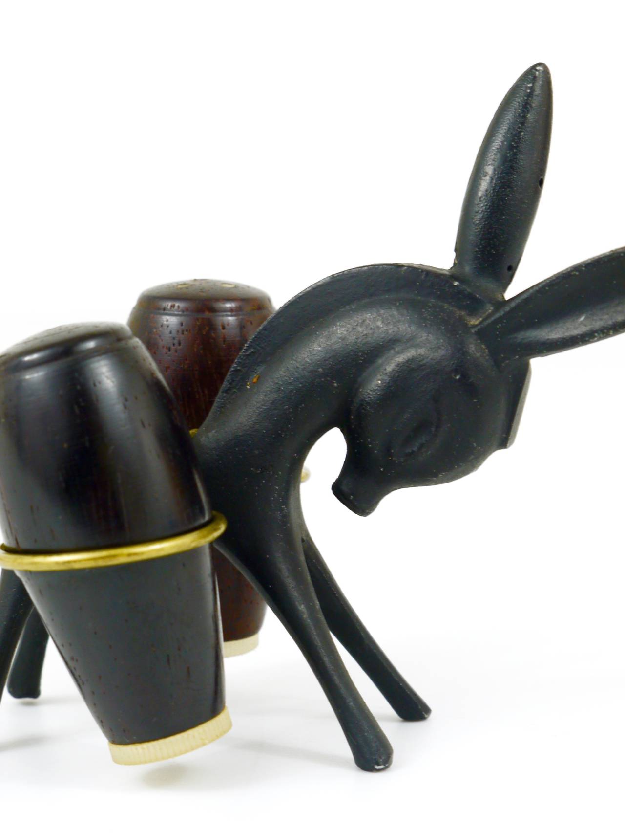 A very charming Viennese shaker set, displaying a donkey. A very humorous design by Walter Bosse, executed by Hertha Baller Austria in the 1950s. Made of metal and wood.
