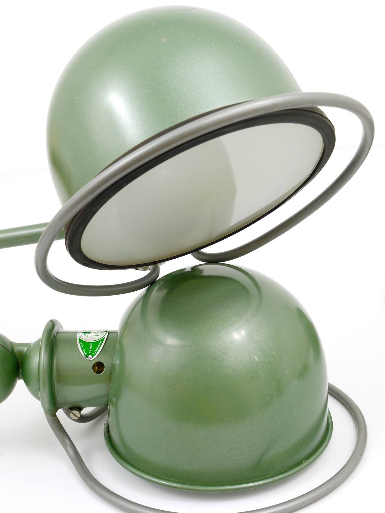 Up to two identical green clamp lamps by Jean Louis Domecq for Jielde Lyon/France. Unrestored vintage originals from the 1950s. They will be delivered with clamp bases, but you can use them also as sconces or mount them directly on the tabletop.