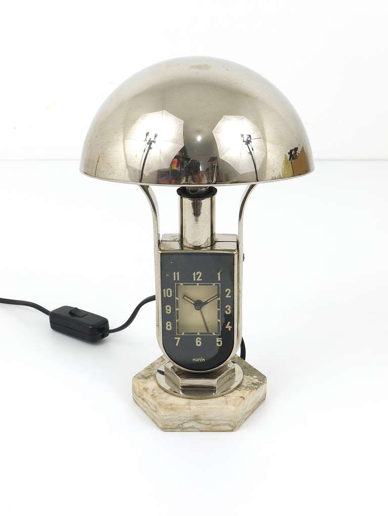A beautiful Hungarian 1930s side lamp with integrated alarm clock. Made of nickel-plated metal, has a nice marble base and an adjustable hemispheric lampshade. Fully working. In good condition, with patina on the metal. Please notice that there is