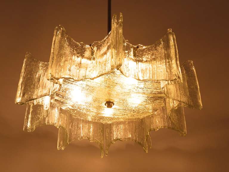 A beautiful Viennese Modernist star chandelier, designed and executed by J.T. Kalmar Vienna. White painted metal frame with nickel-plated hardware and textured glass. In very good condition. Making a wonderful light. We offer to rewire the