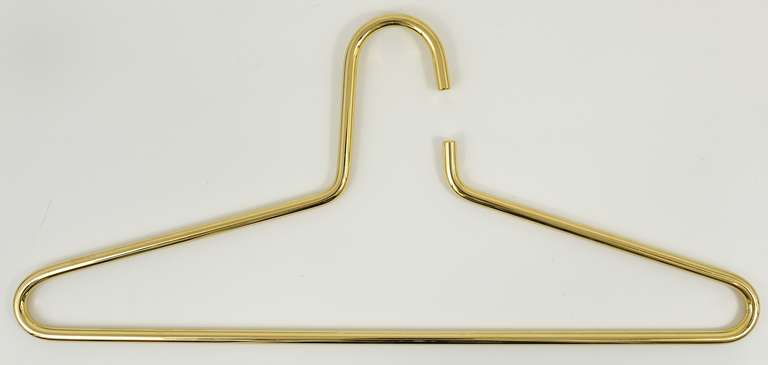 Set of 6 beautiful hangers, designed an executed by Carl Aubock, Vienna, in the 1970s. Very solid and stylish pieces, made of gold-plated brass, in excellent condition. 16 1/2