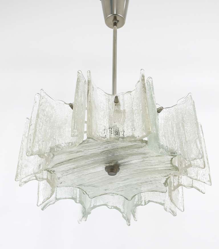 A beautiful Viennese modernist star chandelier, designed and executed by Kalmar Vienna. White painted metal frame with nickel-plated hardware and textured glass. In very good condition. Making a wonderful light.
   