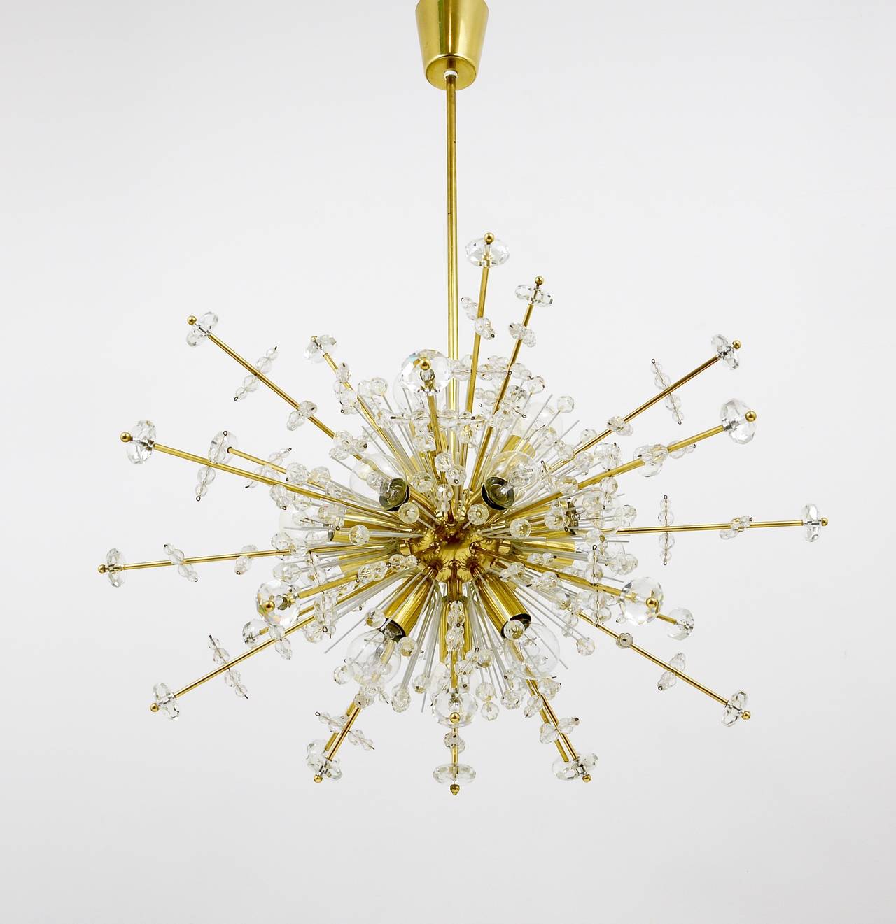 A unique Austrian blowball Sputnik chandelier, designed by Emil Stejnar, designed by Rupert Nikoll, Austria, 1950s. A rare model with long brass rays and a lot of sparkling crystals. It has 14 sockets. In very good condition with marginal patina on