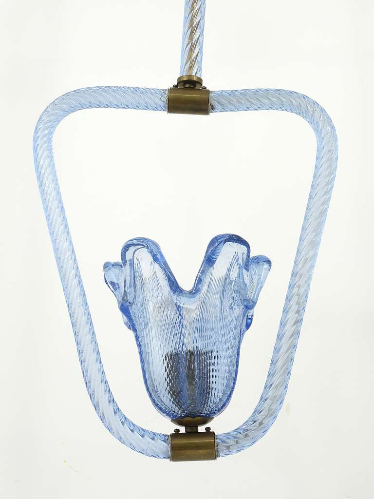 A beautiful pendant lamp, made of blue Murano glass with brass details, executed by Barovier & Toso in the 1940s.