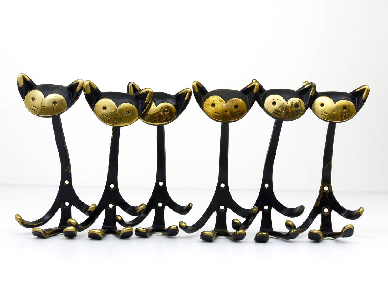 Austrian Up to Eight Walter Bosse Brass Animal Wall Hooks Displaying a Cat Austria, 1950s