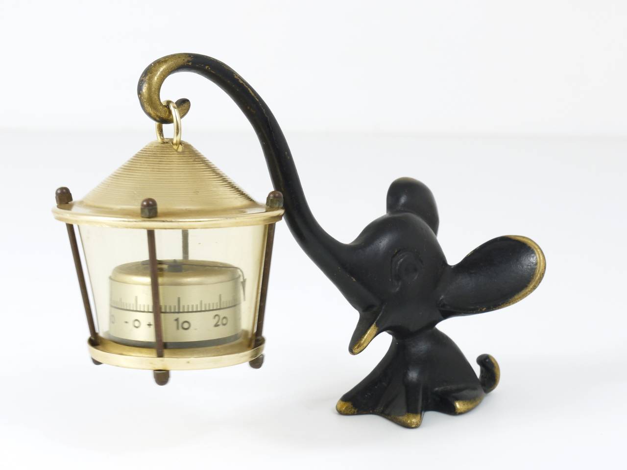 A charming Austrian desk thermometer, consisting of a lovely elephant figurine and a lantern-shaped thermometer. A very humorous design by Walter Bosse, executed by Hertha Baller Austria in the 1950s. Made of brass, in excellent condition.