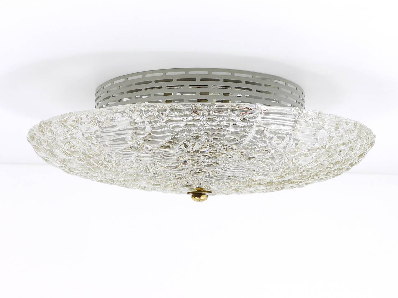 A beautiful flush mount ceiling lamp from the 1960s, made by J.T. Kalmar Austria. A charming light, made of solid textured glass on a metal base, with a nice brass knob in the center. Has three sockets. Very good condition, nice patina. Gives