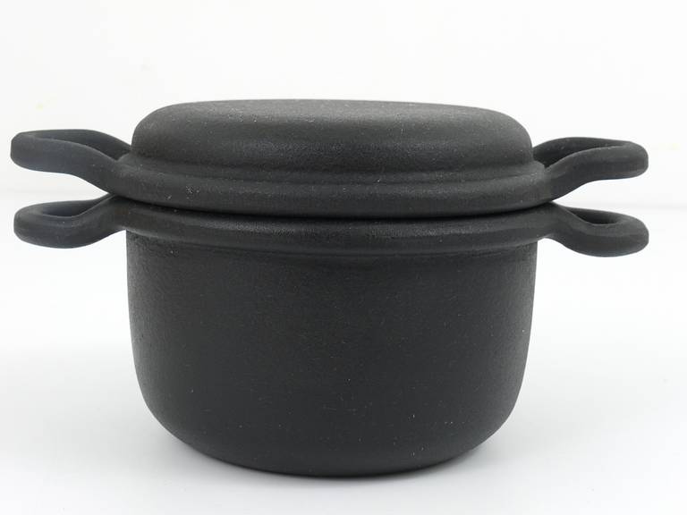 A very beautiful cast iron pot with lid, very solid
designed by Carl Auböck, Vienna.
Executed by Ostovics/Vienna, 1970s.
Diameter without handles 7 in
Excellent condition, unused in original box.

We are offering many other Carl Auböck cookware,