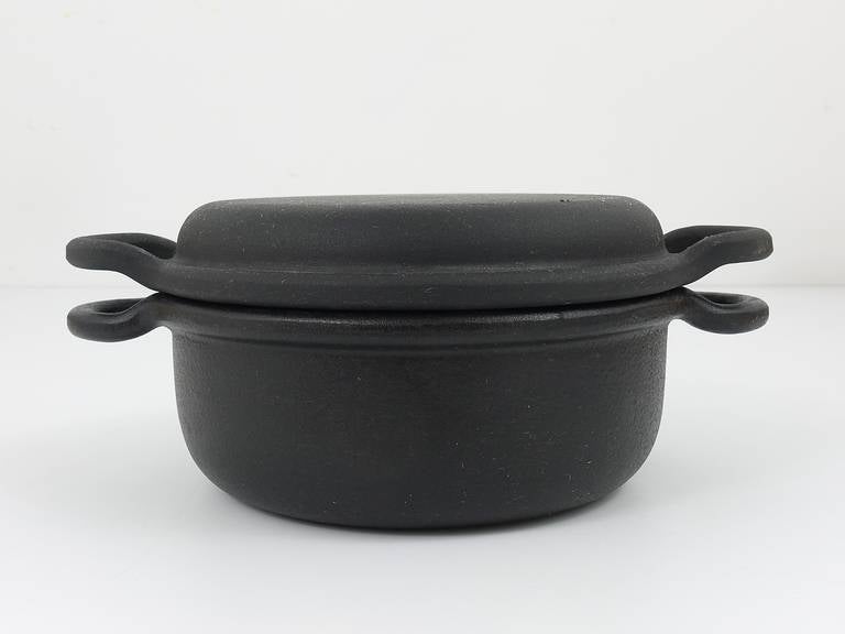 A very beautiful cast iron pot with lid, very solid
designed by Carl Aubock Vienna.
Executed by Ostovics, Vienna, 1970s.
Diameter without handles 8,25 in
Excellent condition, unused in original box

We are offering many other Carl Aubock cookware,
