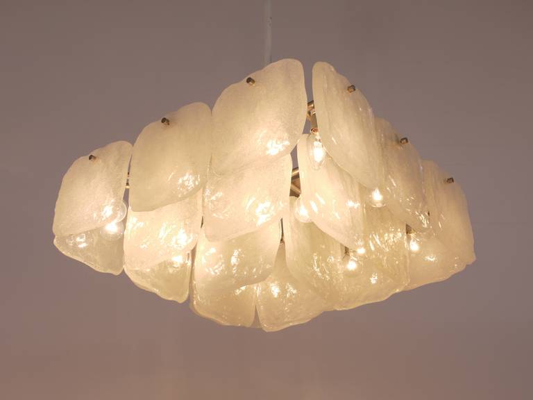 A beautiful Midcentury chandelier form the 1960s, manufactured by J.T. Kalmar Vienna, Austria. Stunning design, the chandelier has 24 square thick frosted ice glass panels (7x7 in) dangling on it. In very good condition with marginal patina on the